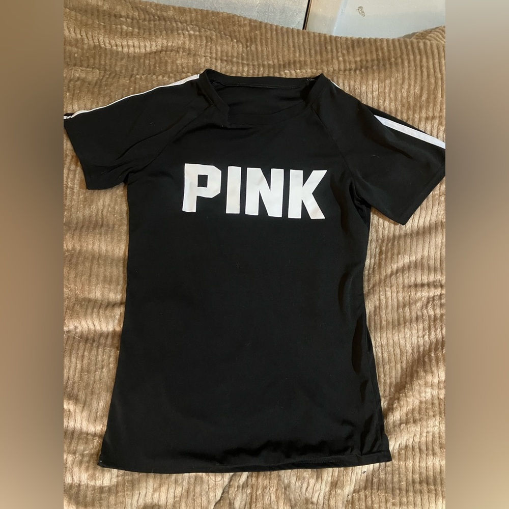 PINK tshirt size large but fits like a medium. pic don’t do justice it’s new!